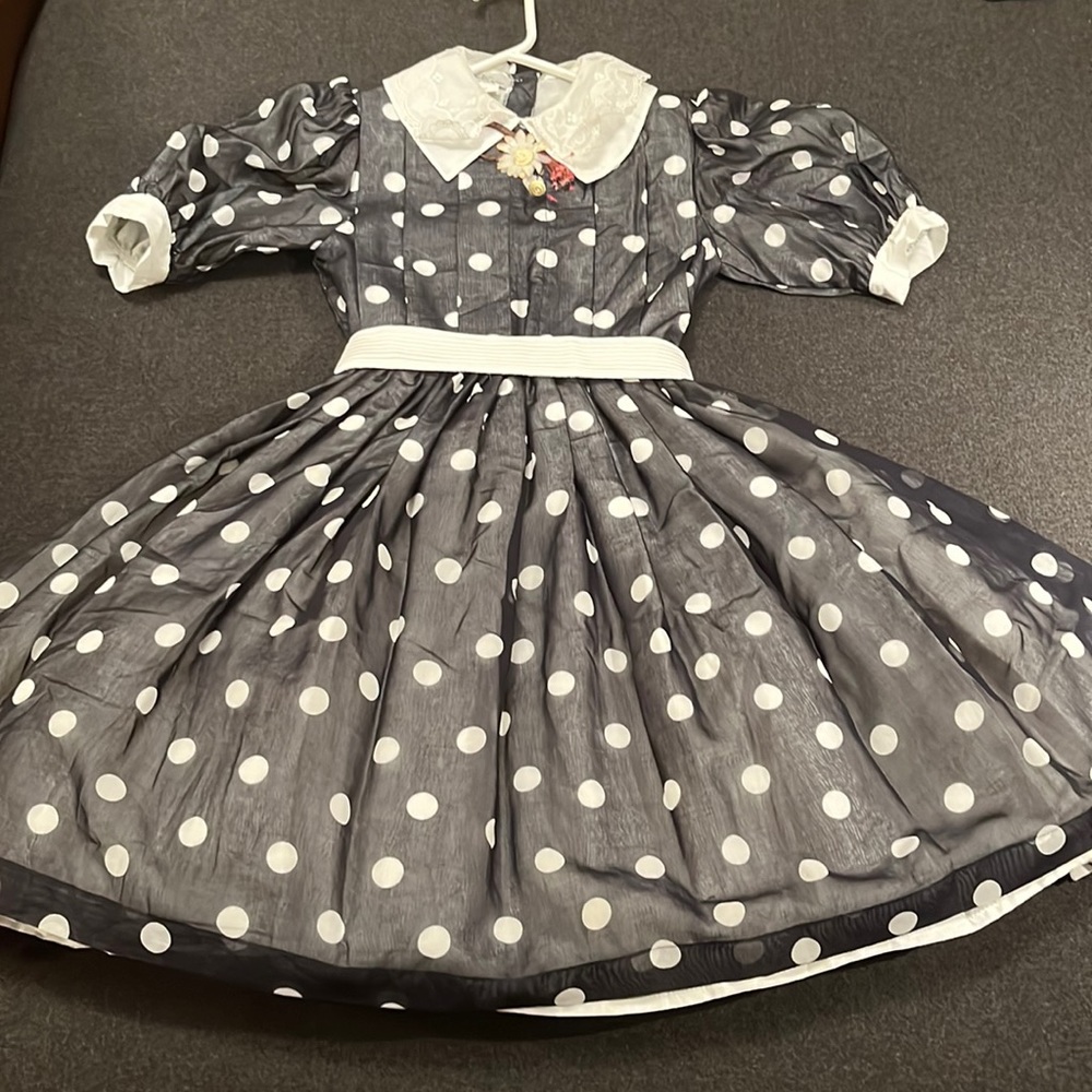 Fully lined with crinoline. Agoya buttons(worth a fortune) Easter dress.